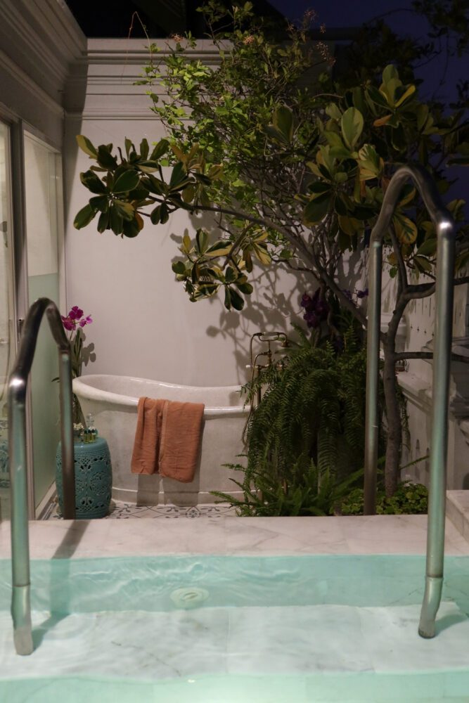 Elegant private pool suite at The Inside House in Chiang Mai, Thailand, featuring a marble plunge pool, outdoor soaking tub, and lush greenery for a luxurious and tranquil retreat.