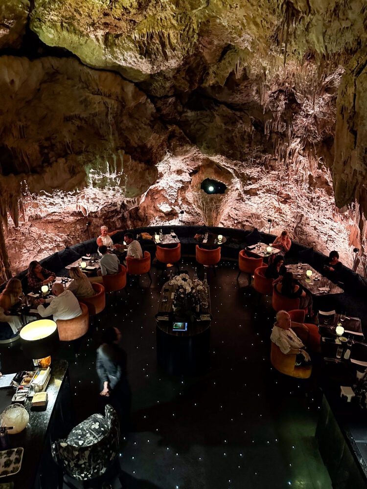 Elegant underground dining experience inside a dramatic limestone cave at The Cave by Chef Ryan Clift in Bali.