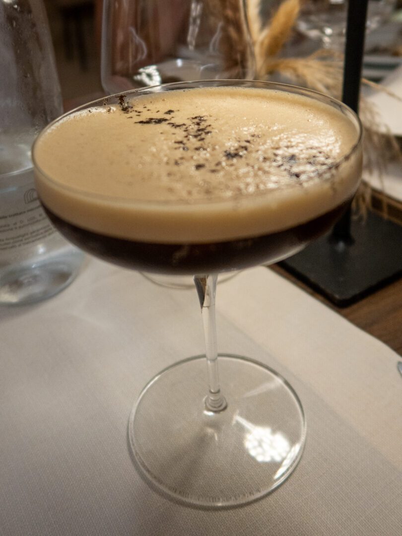 Espresso martini served in a coupe glass at Antica Posta restaurant in Monopoli, Puglia.