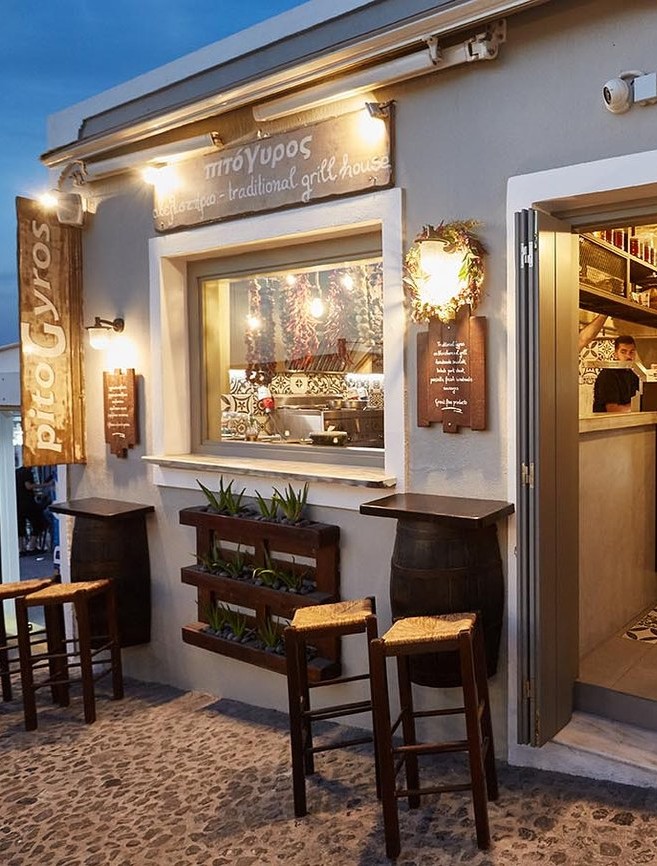 Storefront of Pitogyros Traditional Grill House in Oia, Santorini, a popular spot for gyros and souvlaki.